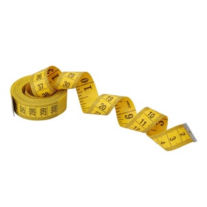 May include: A yellow measuring tape with black numbers is coiled up. The tape is marked in inches and has the word "CHINA" printed on it.
