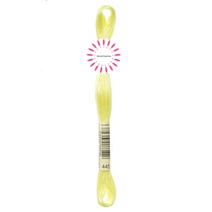 May include: A skein of pale yellow embroidery floss with a label that reads "445" and a barcode.
