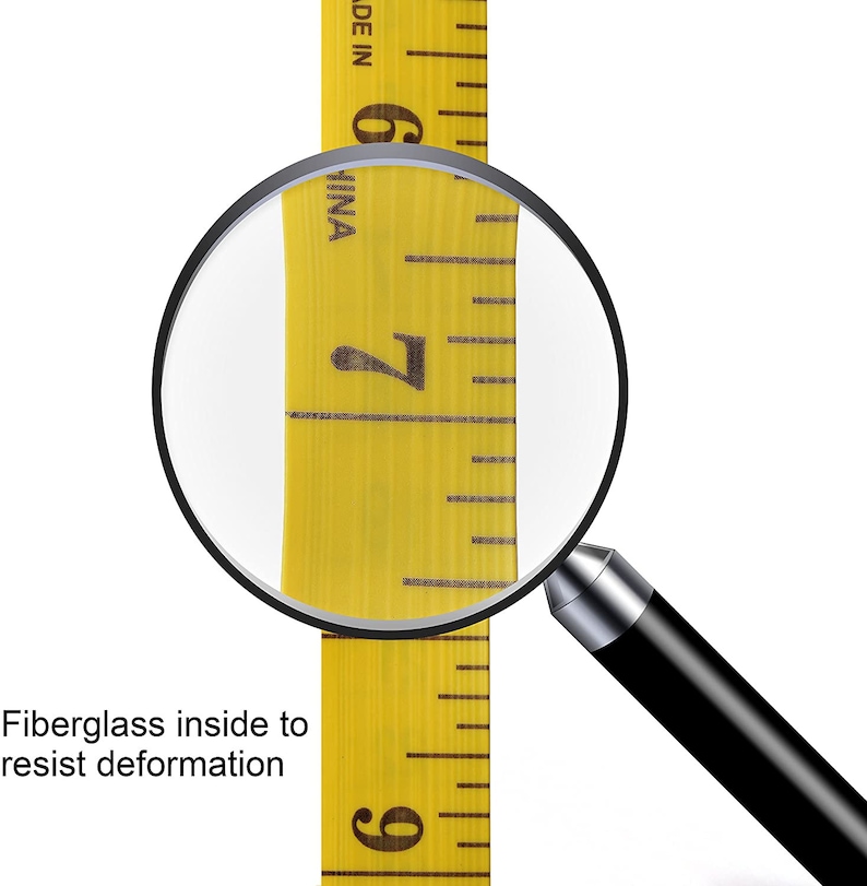 May include: A close-up of a yellow measuring tape with black markings. The tape is labeled "MADE IN CHINA" and shows the numbers 6, 7, and 9. A magnifying glass is positioned over the number 7. The text "Fiberglass inside to resist deformation" is visible below the tape.