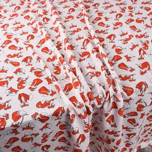 May include: White fabric with a repeating pattern of red foxes. The foxes are stylized and facing different directions.