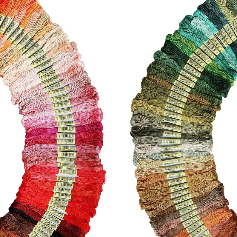 May include: Two sets of embroidery floss spools, one set in shades of red, pink, and orange, and the other set in shades of green, brown, and beige.
