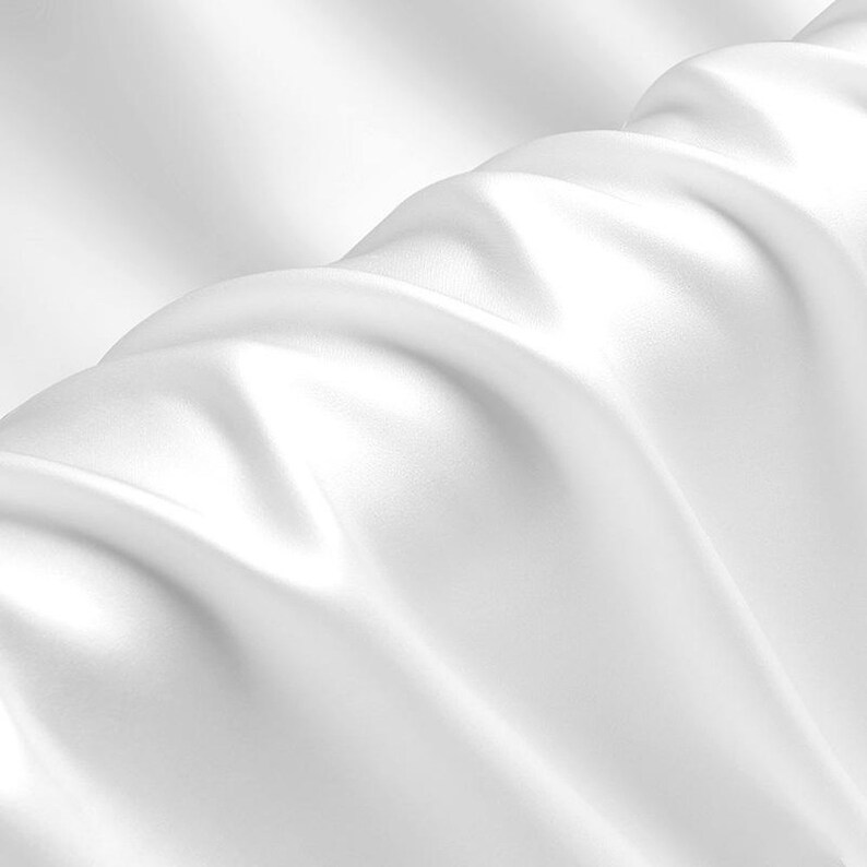 May include: White satin fabric with soft, flowing folds and a smooth, luxurious texture.