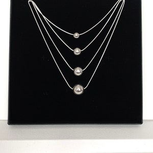 Silver floating ball necklaces,sterling silver ball pendant on a good quality snake chain, sterling silver balls in 8mm, 10mm, 12mm and 14mm