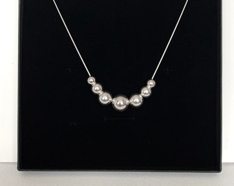 Large silver ball necklace with various size balls, 14,12,10 and 8mm balls floating on a smooth sterling silver snake chain. Stunning gift.