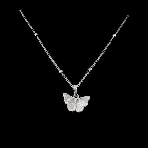Silver butterfly necklace, sterling silver butterfly pendant hung from an adjustable 16 to 18 inch length sterling silver satellite chain.