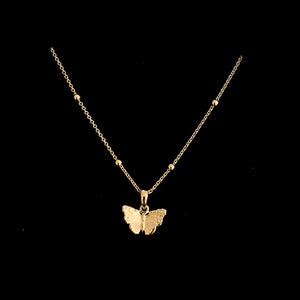 Gold butterfly necklace. A delicate gold plated sterling silver butterfly pendant hung from an adjustable 16 to 18 inch satellite chain.
