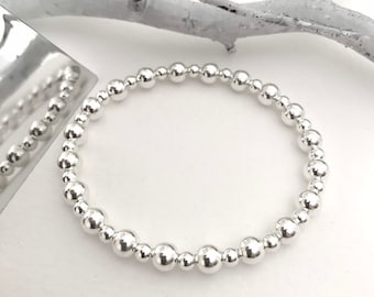 Sterling silver ball bracelet. 4mm and 6mm balls threaded on jewellers elastic, stacking bracelet, layering bracelet, handmade bracelet.