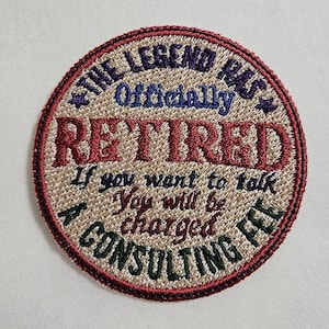 May include: Embroidered patch with the text "THE LEGEND HAS Officially RETIRED". The patch is circular with a red border and features additional text: "If you want to talk, You will be charged A CONSULTING FEE."
