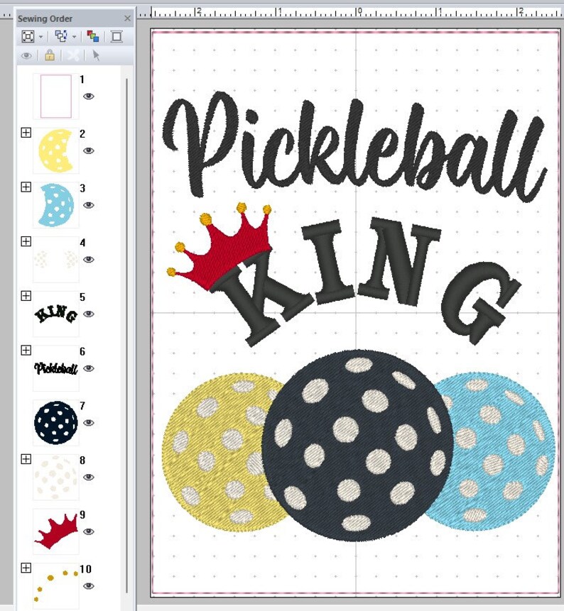 May include: A black and white embroidery design featuring the words "Pickleball King" with a crown above the word "King". Three pickleball paddles are shown below the text, one yellow, one blue, and one black.