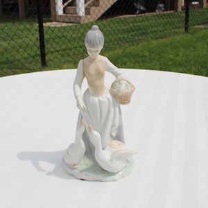 Porcelain Girl with Basket Feeding Ducks  Figurine