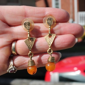 Gold Dangle / Drop Pierced Earrings with and Orangish Stone