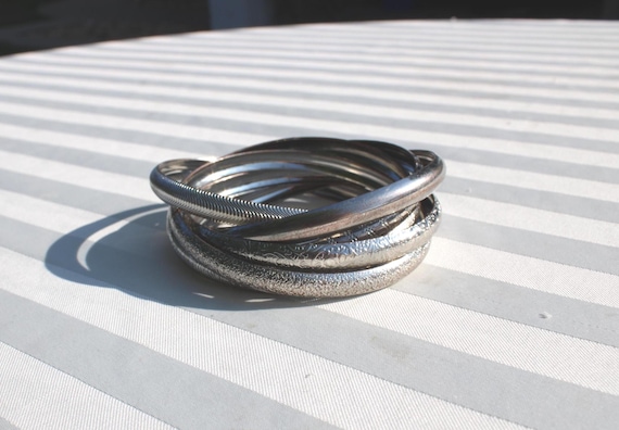 Six Silver Tone Metal Interlocking Bangle Bracele… - image 1