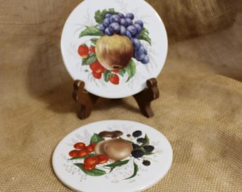 Pair of Mid State Round Ceramic Fruit Motif Trivets