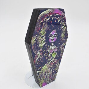 Horror doll art print on a 6&quot; wood coffin lid frame