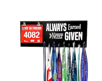 May include: A black wooden medal display with the text "ALWAYS Earned >>Never GIVEN". A red race bib with the number "4082" is attached to the display.  The display has hooks for hanging medals, and several colorful medals are hanging from the hooks.