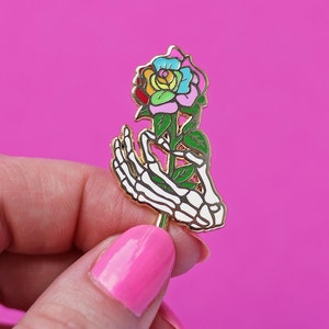 Skeletal hand holding a rainbow rose, enamel pin - bones - skeleton pin - anatomy - rainbow pin - pride pin - pin badge - flair - lapel pin