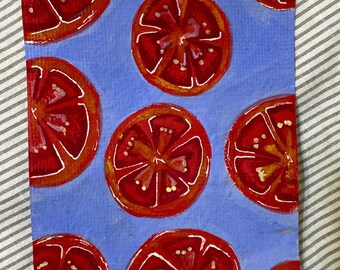 Watercolor painting of tomato on blue background on handmade paper