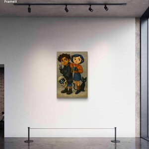 May include: A framed artwork featuring two cartoon characters, a boy and a girl, standing side by side. The boy holds a skull with a glowing eye, and the girl has a black cat at her feet. The artwork is displayed on a white wall.