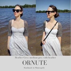 May include: A woman wearing a white dress and a heather gray shrug. The shrug has short sleeves. The text "ORNUTE" is at the bottom of the image, along with "Heather Grey: medium grey with heather" and "Handmade in Minneapolis".