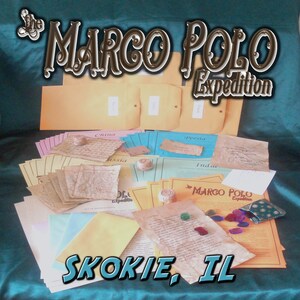 May include: An assortment of aged paper documents, envelopes, and small decorative items are arranged on a teal surface. The text "The Marco Polo Expedition" and "Skokie, IL" are prominently displayed in stylized fonts, suggesting a themed product.
