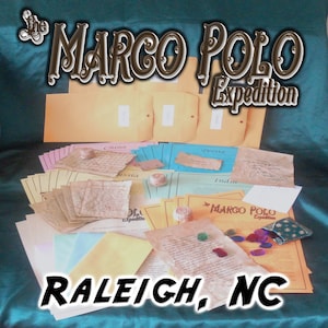 May include: The Marco Polo Expedition kit with various aged paper documents, envelopes, and small decorative items. The text "The Marco Polo Expedition" and "Raleigh, NC" are displayed in the image.