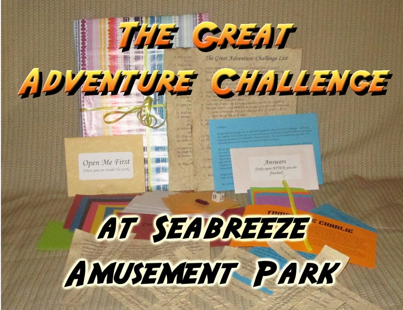 May include: A collection of colorful paper items, including cards and envelopes, with the text "THE GREAT ADVENTURE CHALLENGE AT SEABREEZE AMUSEMENT PARK." Some items are tied with a green ribbon. One card reads "Open Me First."