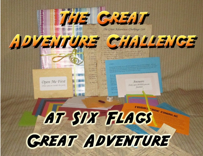 May include: A collection of colorful cards, envelopes, and papers with the text "THE GREAT ADVENTURE CHALLENGE" and "AT SIX FLAGS GREAT ADVENTURE". Includes a bundle tied with a green ribbon and the text "Open Me First".