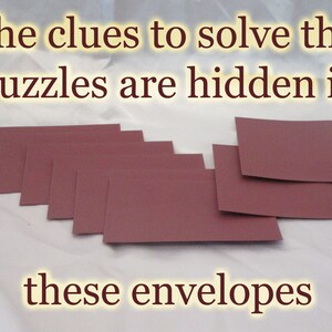May include: A collection of mauve-colored envelopes arranged on a light background. The text at the top reads "The clues to solve the puzzles are hidden in" and the text at the bottom reads "these envelopes".