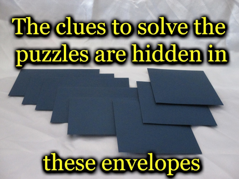 May include: A collection of dark blue envelopes arranged on a white surface. The text at the top reads "The clues to solve the puzzles are hidden in" and the text at the bottom reads "these envelopes".