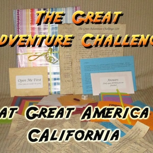 May include: A collection of adventure-themed items, including cards, notes, and a wrapped package. Text on the items reads "THE GREAT ADVENTURE CHALLENGE" and "AT GREAT AMERICA CALIFORNIA". The package is tied with a green ribbon.