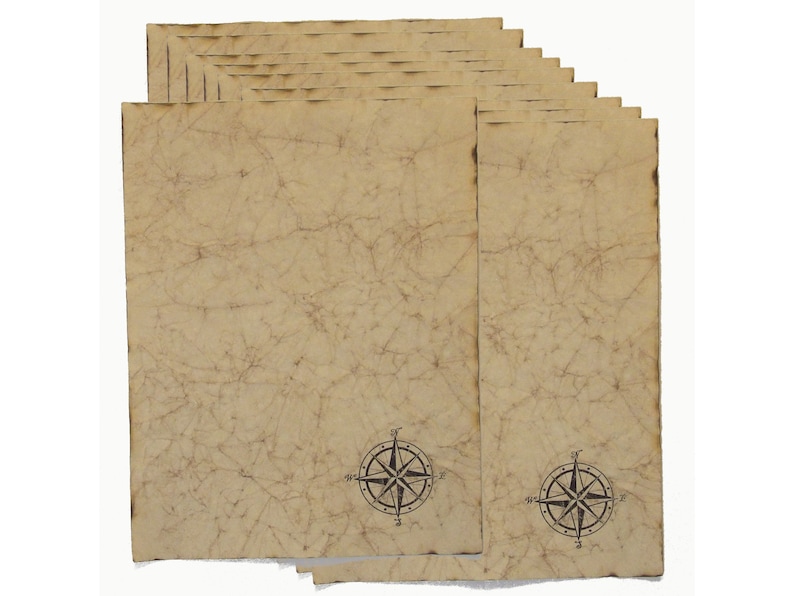 May include: A stack of aged-looking paper sheets with a vintage map design. The paper has a tan color with a network of lines and a compass rose at the bottom. The edges of the paper have a slightly burnt appearance, giving it an antique aesthetic.