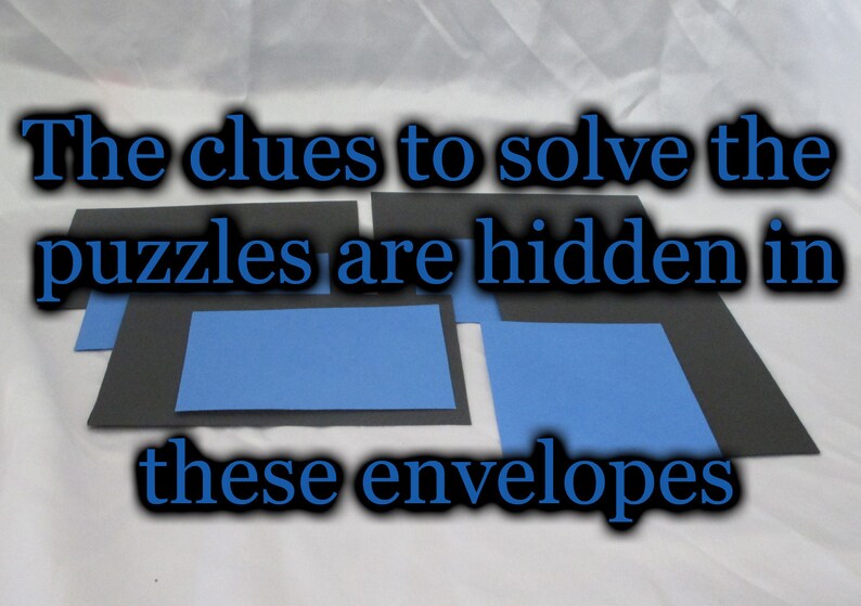 May include: Image shows black and blue rectangular envelopes. Text in blue reads: "The clues to solve the puzzles are hidden in these envelopes."