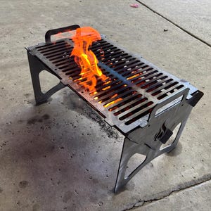 Parrilla de barbacoa portátil plegable de 20 x 12 pulgadas cortada de acero de calibre 10