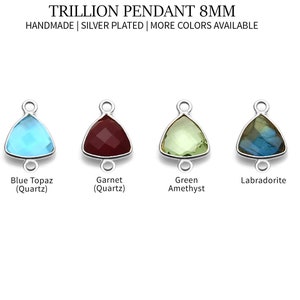 May include: Four silver plated trillions pendants with different colored gemstones. The pendants are 8mm in size and are available in blue topaz, garnet, green amethyst, and labradorite.