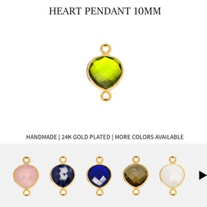 May include: A gold-plated heart pendant with a green gemstone. The pendant is 10mm in size and has two jump rings for attaching to a chain or cord.
