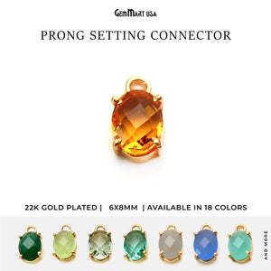 May include: Gold-plated prong setting connector with an oval-shaped gemstone. The connector is 6mm by 8mm and is available in 18 colors.  22K Gold Plated | 6X8MM | AVAILABLE IN 18 COLORS