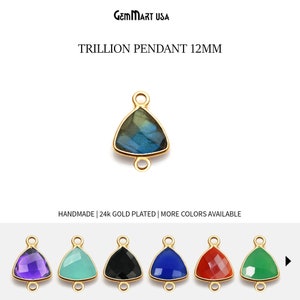 May include: Gold plated trillion pendant with a 12mm gemstone. Available in amethyst, aquamarine, black onyx, blue lapis lazuli, red carnelian, and green jade.