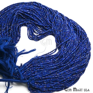 May include: A strand of deep blue lapis lazuli beads, faceted and strung on a thin thread. The beads are small and uniform in size, creating a smooth and elegant look.