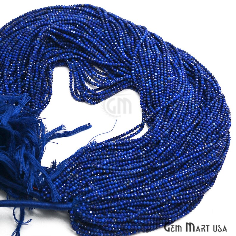May include: A strand of deep blue lapis lazuli beads, faceted and strung on a thin thread. The beads are small and uniform in size, creating a smooth and elegant look.