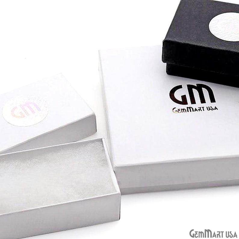 May include: A collection of three jewellery boxes including one large square white box with the black text GM GemMart USA, one small rectangular white box with a circular sticker, and one small black box with a white circular sticker on top.