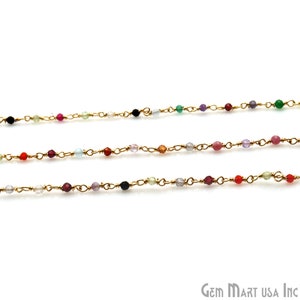 May include: Three gold chains with colorful gemstone beads. The beads are different colors and sizes. The chains are delicate and would be perfect for a necklace or bracelet.