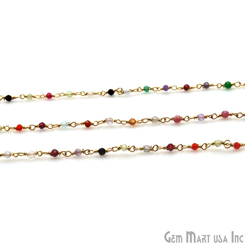 May include: Three gold chains with colorful gemstone beads. The beads are different colors and sizes. The chains are delicate and would be perfect for a necklace or bracelet.