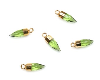 May include: Five green gemstone pendants with gold-toned caps. Each pendant is shaped like a pointed teardrop.