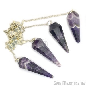 May include: Four amethyst crystal pendulums with silver chains. The pendulums are faceted and have a pointed shape. The amethyst crystals have a mix of purple and white colors. The chains connect to clear crystal beads.