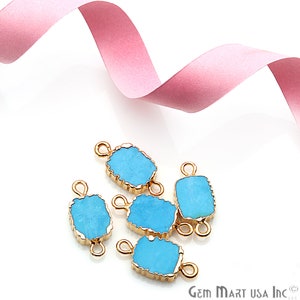 May include: Six turquoise blue gemstone connector charms with gold-toned metal accents. Each charm has two loops for attaching to jewelry.