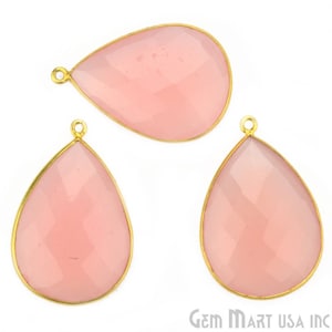 May include: Three pink chalcedony teardrop shaped pendants with gold plated bezels and jump rings.
