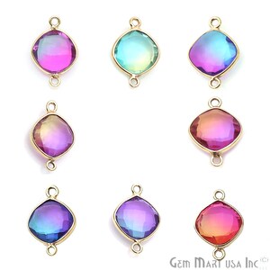 May include: Assortment of six iridescent glass gemstone connector charms with gold-tone metal settings. Each charm features a different color gradient, including pink, blue, purple, and orange.
