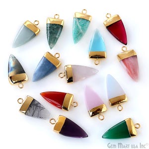 May include: Assortment of 14 gold-plated gemstone arrowhead pendants. The pendants are made of various gemstones, including amethyst, agate, aventurine, and rose quartz. Each pendant features a gold-plated cap and a loop for attaching to a chain or cord.