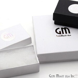 May include: Three white gift boxes with a white foam insert. The largest box has the logo "GM GemMart USA" printed on the top.
