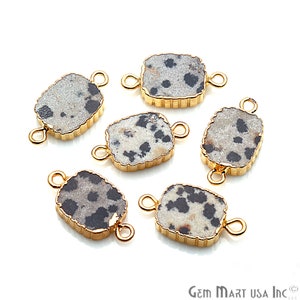 May include: Six gold-toned metal connector charms with a dalmatian jasper stone inlay. Each charm has two loops for attaching to jewelry.